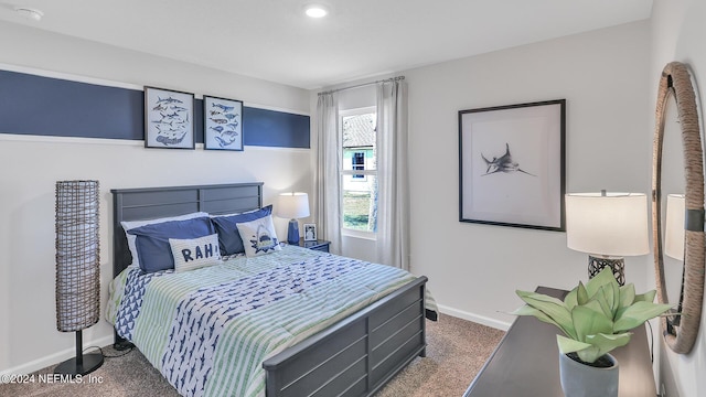 carpeted bedroom featuring baseboards and recessed lighting