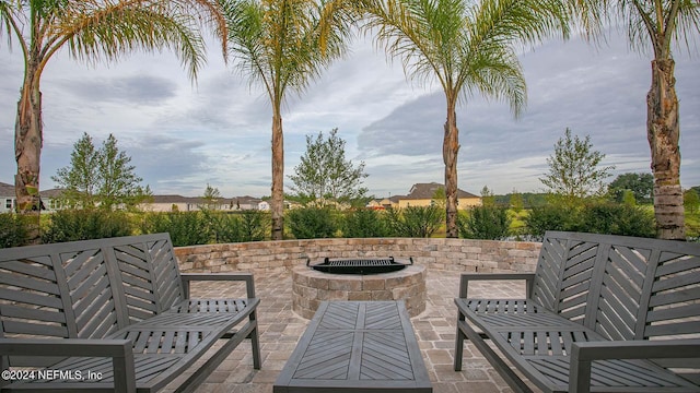 view of patio with a fire pit