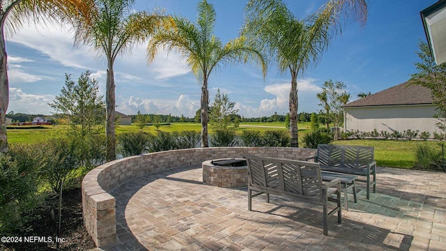 view of patio with an outdoor fire pit