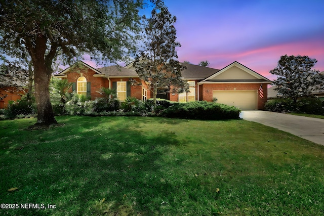 809 Ifield Rd, Saint Augustine, FL 32095 - single story home featuring brick siding, concrete driveway, an attached garage, and a lawn
