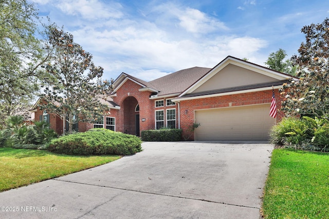 809 Ifield Rd, Saint Augustine, FL 32095 - view of front of home with brick siding, concrete driveway, an attached garage, and a front yard