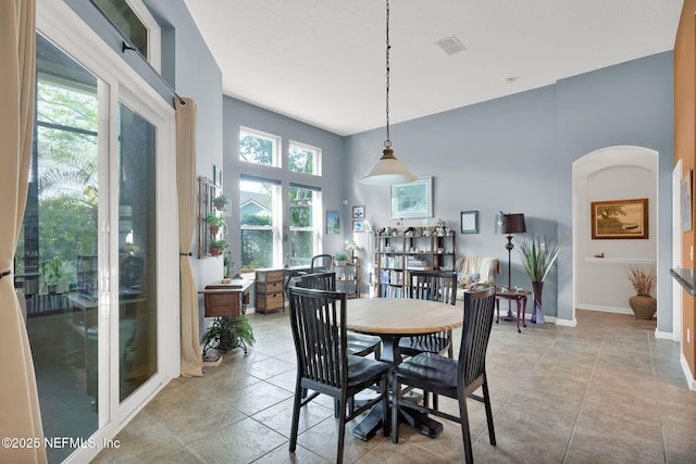 809 Ifield Rd, Saint Augustine, FL 32095 - dining space with a towering ceiling and baseboards