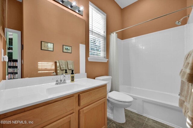 809 Ifield Rd, Saint Augustine, FL 32095 - full bathroom featuring toilet, vanity, tile patterned flooring, and shower / tub combo