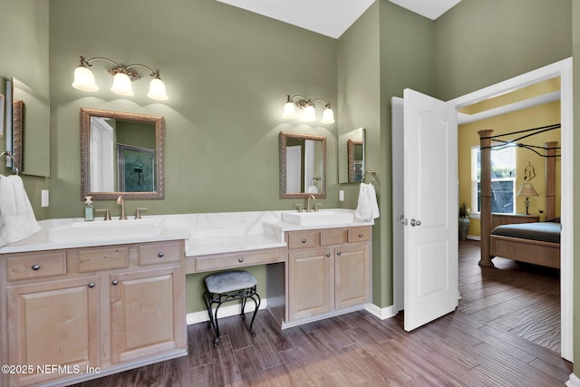 809 Ifield Rd, Saint Augustine, FL 32095 - bathroom with wood finished floors, double vanity, and baseboards