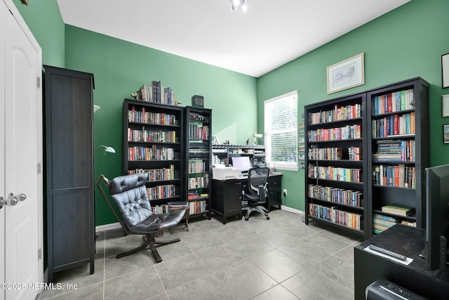809 Ifield Rd, Saint Augustine, FL 32095 - home office featuring bookshelves and baseboards
