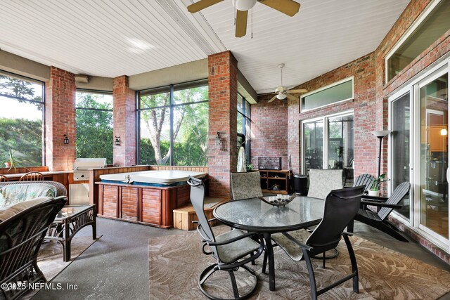 809 Ifield Rd, Saint Augustine, FL 32095 - sunroom with a ceiling fan, brick wall, a jacuzzi, and outdoor dining space
