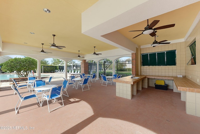 809 Ifield Rd, Saint Augustine, FL 32095 - view of patio / terrace with a ceiling fan, fence, a pool, and a sink