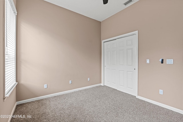 13111 Hammock Cir S, Jacksonville, FL 32225 - unfurnished bedroom featuring carpet floors, baseboards, and a ceiling fan