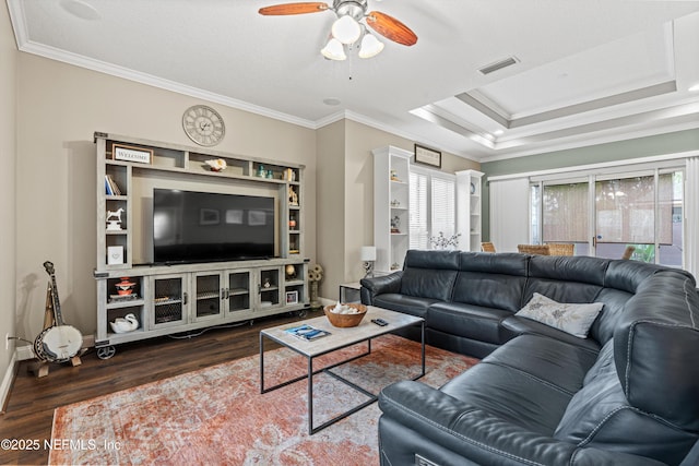 13111 Hammock Cir S, Jacksonville, FL 32225 - living room featuring wood finished floors, ceiling fan, ornamental molding, baseboards, and a tray ceiling