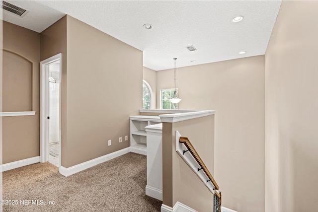 13111 Hammock Cir S, Jacksonville, FL 32225 - corridor with an upstairs landing, carpet floors, baseboards, and recessed lighting