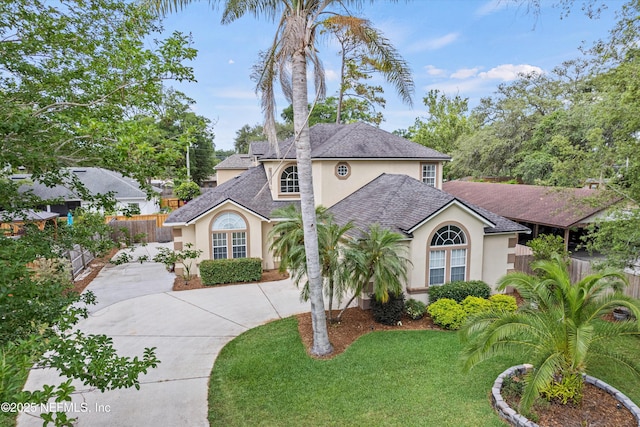13111 Hammock Cir S, Jacksonville, FL 32225 - view of front of home with stucco siding, curved driveway, and roof with shingles