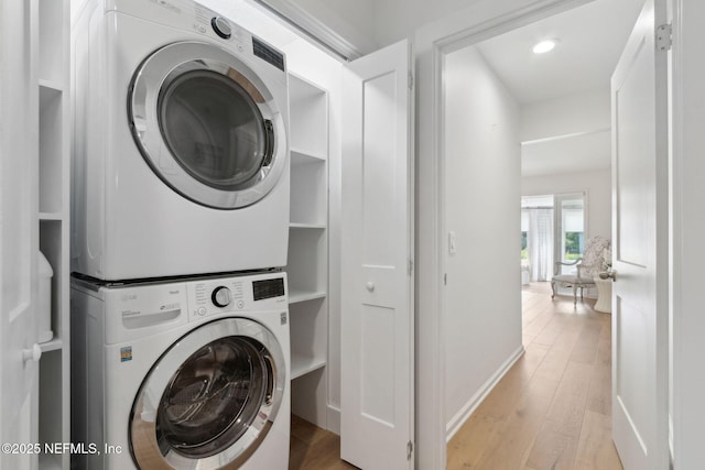 90 Players Club Villas Rd, Ponte Vedra Beach, FL 32082 - clothes washing area featuring stacked washer / dryer, laundry area, light wood-style flooring, and recessed lighting