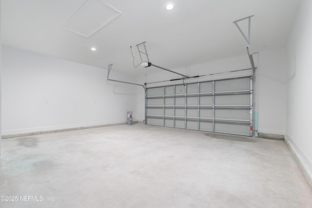 5821 Silver Sands Cir, Keystone Heights, FL 32656 - garage with baseboards, a garage door opener, and recessed lighting