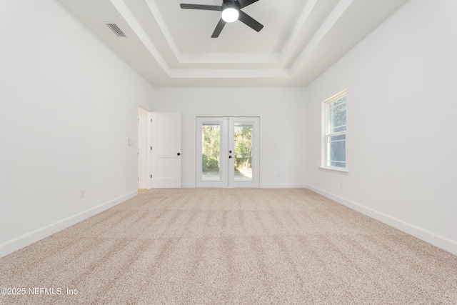 5821 Silver Sands Cir, Keystone Heights, FL 32656 - carpeted spare room featuring a ceiling fan, visible vents, baseboards, and a raised ceiling