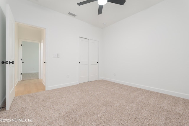 5821 Silver Sands Cir, Keystone Heights, FL 32656 - unfurnished bedroom featuring carpet flooring, a closet, visible vents, and baseboards