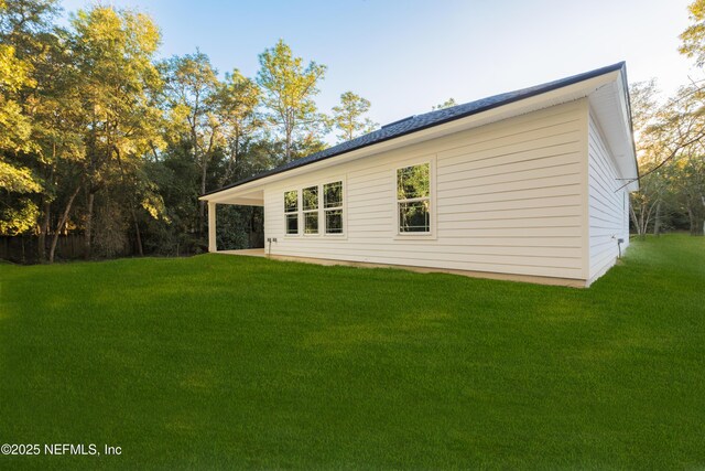 5821 Silver Sands Cir, Keystone Heights, FL 32656 - rear view of house featuring a yard