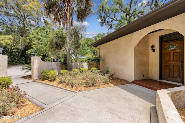 1315 Autumn Trce, Fernandina Beach, FL 32034 - property entrance with stucco siding and fence