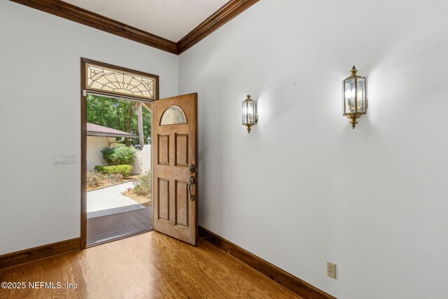 1315 Autumn Trce, Fernandina Beach, FL 32034 - foyer with crown molding, baseboards, and wood finished floors