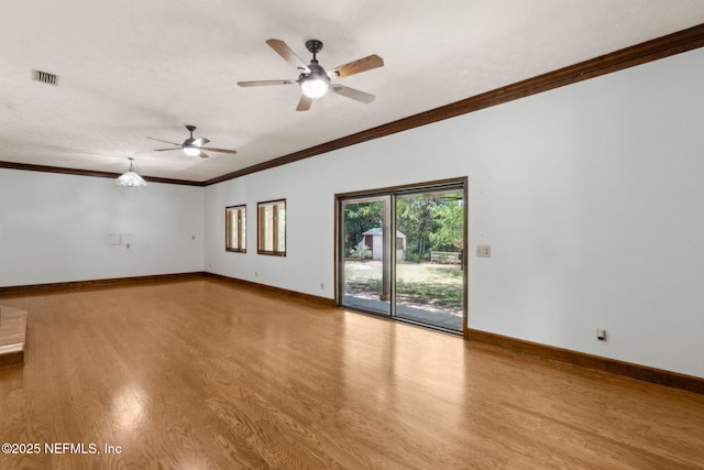 1315 Autumn Trce, Fernandina Beach, FL 32034 - empty room featuring a ceiling fan, visible vents, crown molding, and wood finished floors