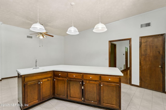 1315 Autumn Trce, Fernandina Beach, FL 32034 - kitchen featuring ceiling fan, light floors, light countertops, and visible vents