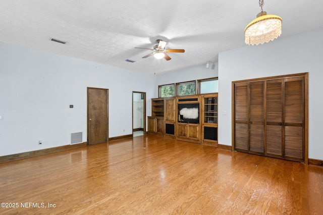 1315 Autumn Trce, Fernandina Beach, FL 32034 - unfurnished living room featuring visible vents, wood finished floors, and ceiling fan