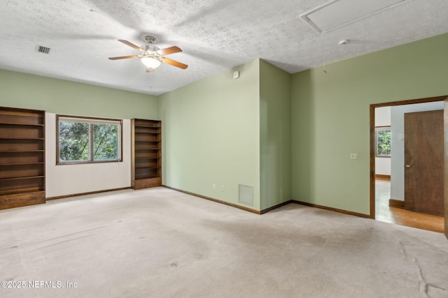 1315 Autumn Trce, Fernandina Beach, FL 32034 - carpeted spare room with ceiling fan, attic access, baseboards, and visible vents