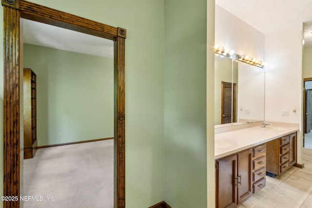 1315 Autumn Trce, Fernandina Beach, FL 32034 - bathroom featuring tile patterned floors, double vanity, and a sink