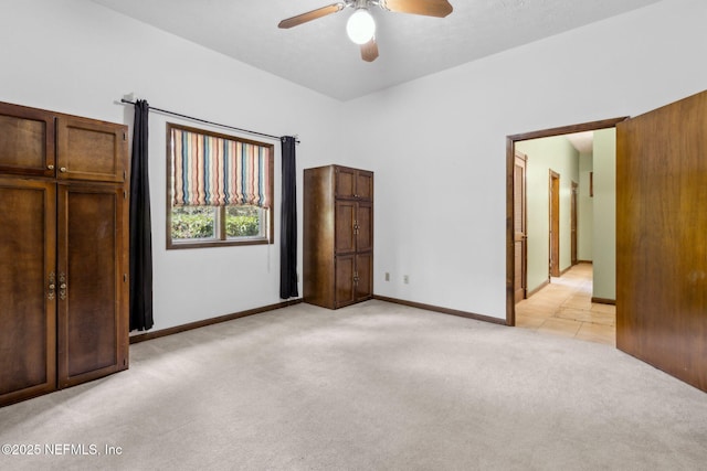 1315 Autumn Trce, Fernandina Beach, FL 32034 - unfurnished bedroom featuring ceiling fan, light carpet, and baseboards