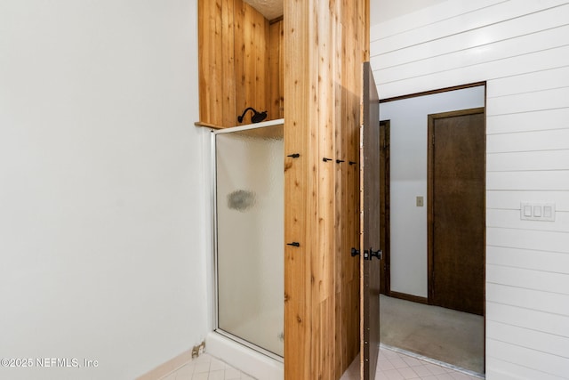 1315 Autumn Trce, Fernandina Beach, FL 32034 - bathroom with a stall shower, tile patterned flooring, and baseboards