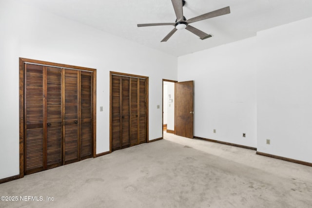 1315 Autumn Trce, Fernandina Beach, FL 32034 - unfurnished bedroom featuring carpet flooring, two closets, and baseboards