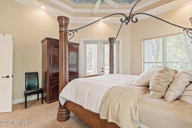 bedroom with light colored carpet, ornamental molding, baseboards, and multiple windows