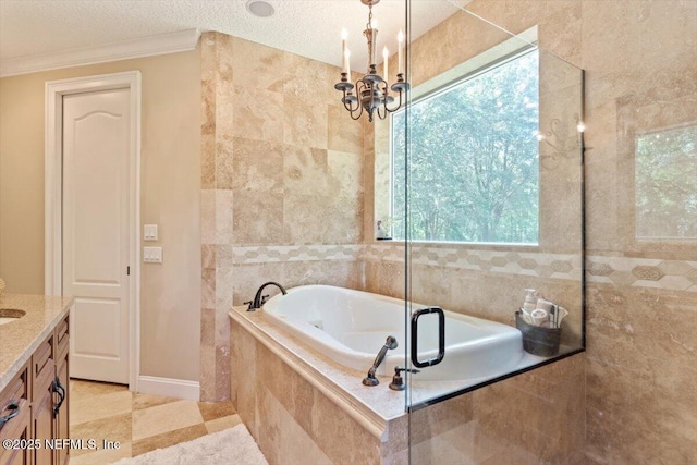 bathroom featuring a garden tub, ornamental molding, a chandelier, vanity, and tiled shower