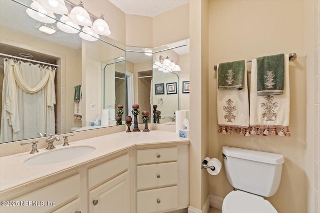 full bath featuring toilet, vanity, and curtained shower