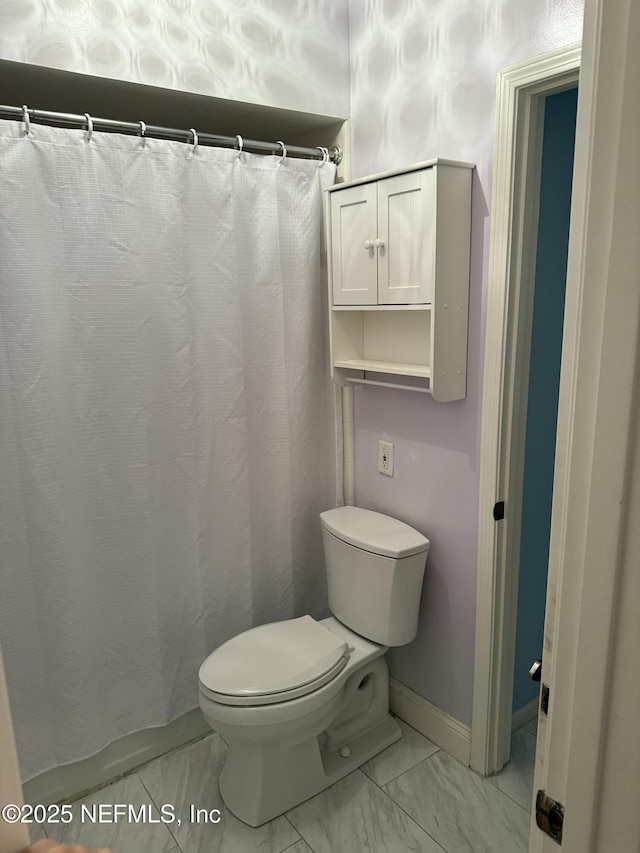 9252 San Jose Blvd Unit 3802, Jacksonville, FL 32257 - bathroom with marble finish flooring, toilet, baseboards, and a shower with curtain