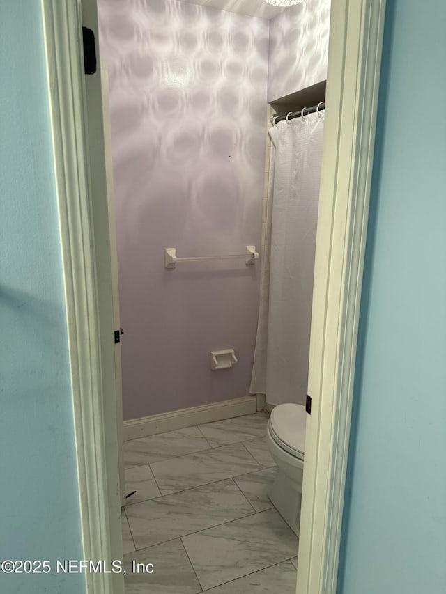 9252 San Jose Blvd Unit 3802, Jacksonville, FL 32257 - full bath featuring marble look tiles, toilet, and baseboards