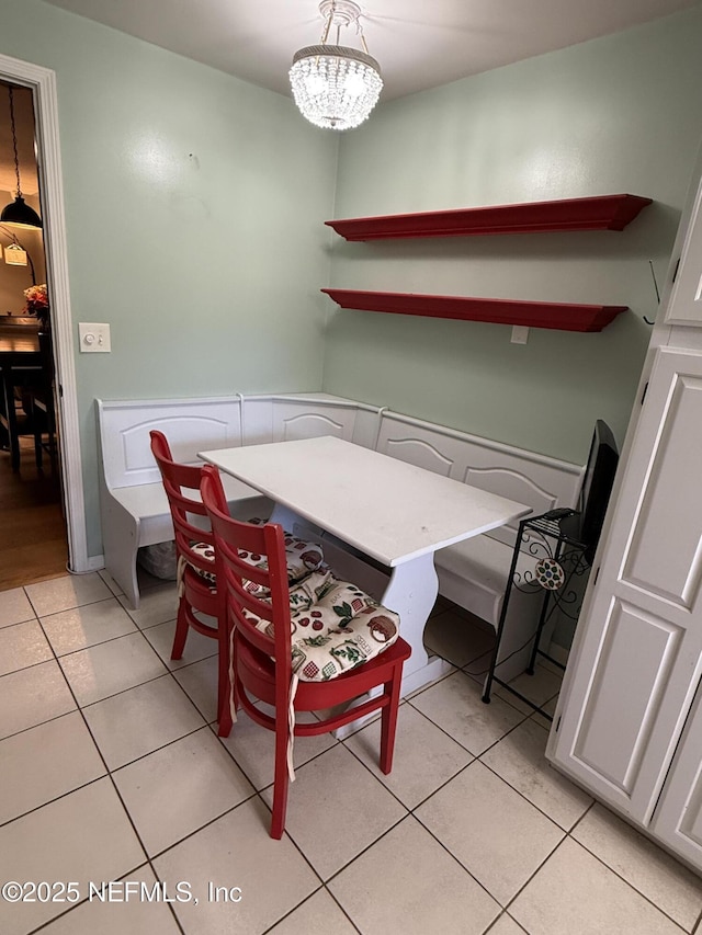 9252 San Jose Blvd Unit 3802, Jacksonville, FL 32257 - dining space with light tile patterned floors and a chandelier