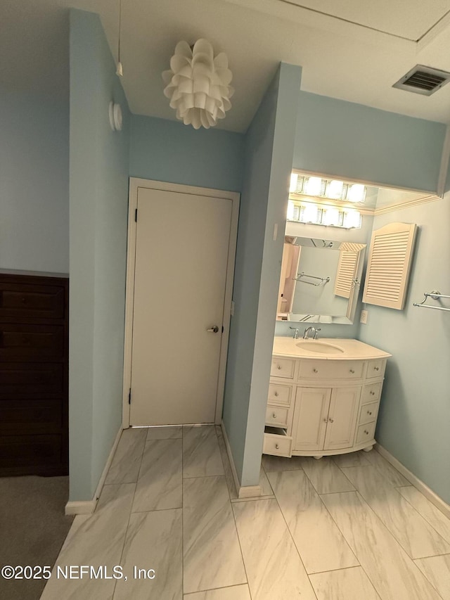 9252 San Jose Blvd Unit 3802, Jacksonville, FL 32257 - bathroom featuring marble look tiles, baseboards, and vanity