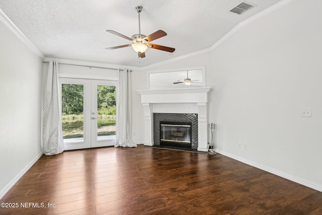 unfurnished living room with lofted ceiling, crown molding, french doors, ceiling fan, and wood finished floors