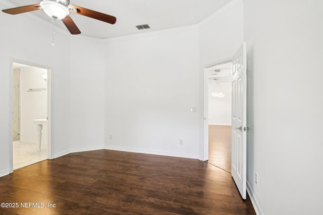 unfurnished room with wood finished floors, a ceiling fan, crown molding, and baseboards