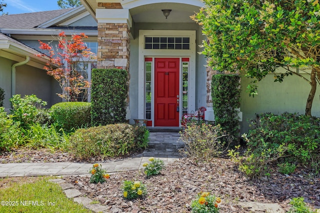 112 Long Branch Way, Saint Augustine, FL 32086 - doorway to property featuring stone siding, stucco siding, and roof with shingles