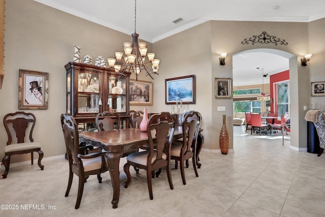 112 Long Branch Way, Saint Augustine, FL 32086 - dining room featuring ornamental molding, a notable chandelier, arched walkways, and baseboards