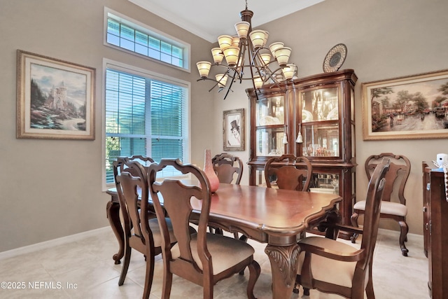 112 Long Branch Way, Saint Augustine, FL 32086 - dining area featuring ornamental molding, a notable chandelier, baseboards, and light tile patterned floors