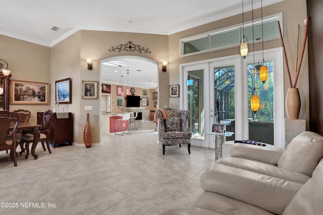 112 Long Branch Way, Saint Augustine, FL 32086 - living area featuring ornamental molding, light tile patterned floors, baseboards, and arched walkways