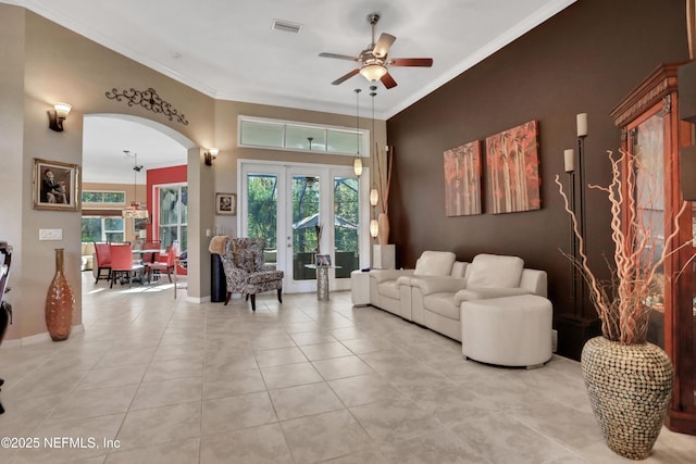 112 Long Branch Way, Saint Augustine, FL 32086 - living room featuring a ceiling fan, visible vents, tile patterned flooring, arched walkways, and ornamental molding