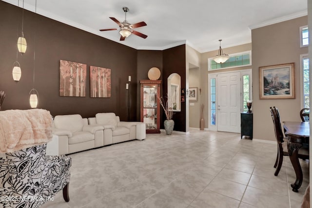 112 Long Branch Way, Saint Augustine, FL 32086 - tiled living area featuring baseboards, a towering ceiling, ceiling fan, arched walkways, and ornamental molding