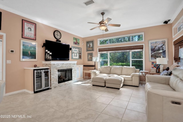 112 Long Branch Way, Saint Augustine, FL 32086 - living area featuring a ceiling fan, crown molding, visible vents, and beverage cooler