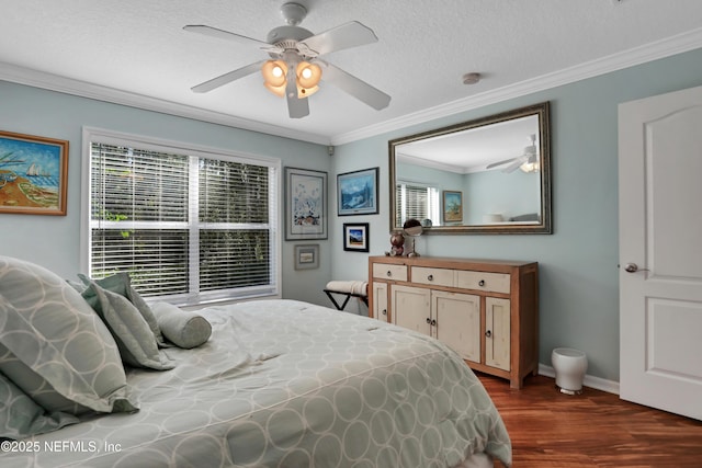112 Long Branch Way, Saint Augustine, FL 32086 - bedroom with a ceiling fan, a textured ceiling, baseboards, ornamental molding, and dark wood finished floors