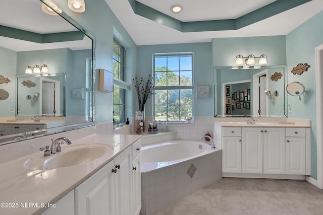 112 Long Branch Way, Saint Augustine, FL 32086 - full bathroom with tile patterned floors, a garden tub, two vanities, and a sink
