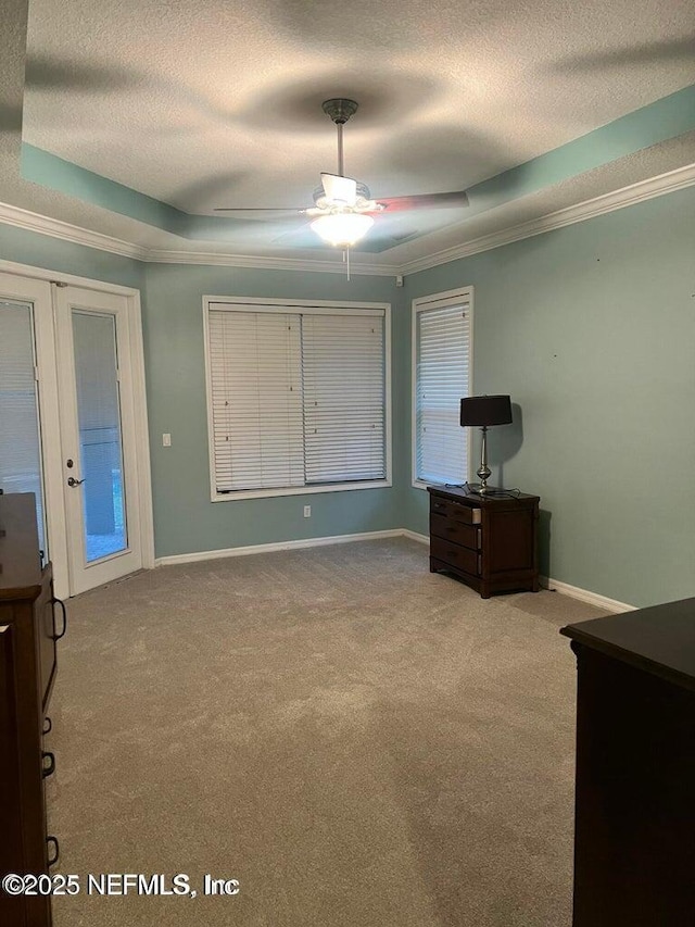 112 Long Branch Way, Saint Augustine, FL 32086 - unfurnished bedroom featuring carpet flooring, french doors, crown molding, and a textured ceiling