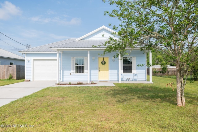 109 N Peachtree St, Hastings, FL 32145 - view of front of house featuring concrete driveway, an attached garage, metal roof, and a porch